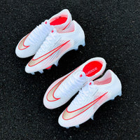 Mercurial football boot featuring a textured gold and red-outlined Swoosh from the Break 'Em pack