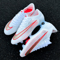 Mercurial football boot featuring a textured gold and red-outlined Swoosh from the Break 'Em pack